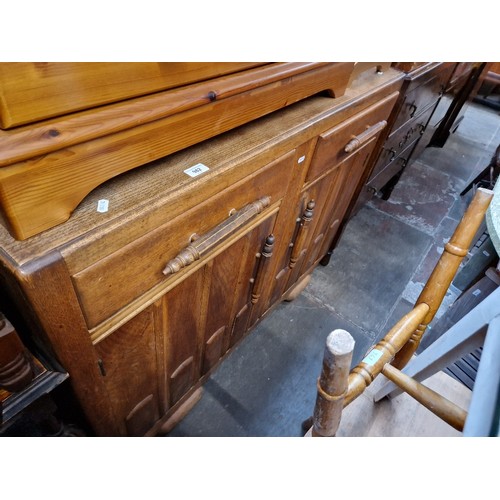 982 - A 1930s oak sideboard and a grandaughter clock of a similar age.