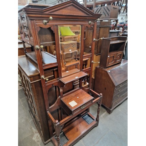 972 - An Edwardian walnut hall stand.