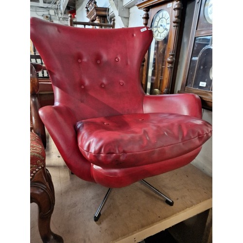 1006 - A mid 20th century G Plan Blofeld wingback swivel chair.