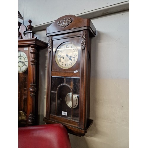 1008 - Early 20th century chiming wall clock with pendulum.