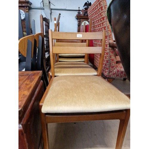 1002 - A set of six mid 20th century Meredew teak dining chairs.