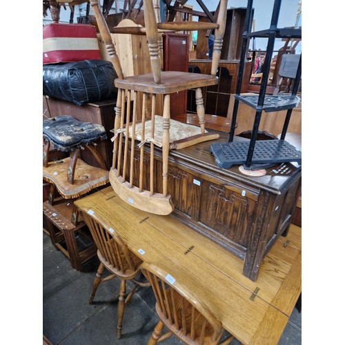 996 - A mixed lot comprising oak table and four chairs, oak linen fold coffer and a beech and elm armchair... 