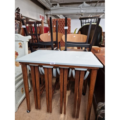 1000 - A set of four mid 20th century Remploy chairs together with set of nesting tables of a similar age.