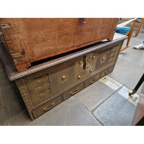 1016 - An Indian hardwood and brass studded chest.