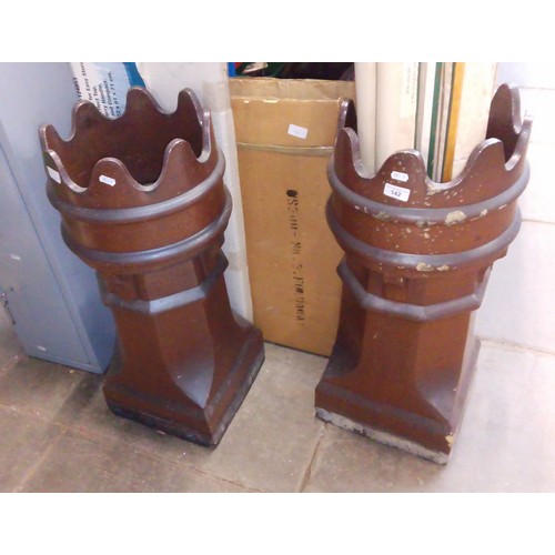 142 - A pair of chimney pot crowns.