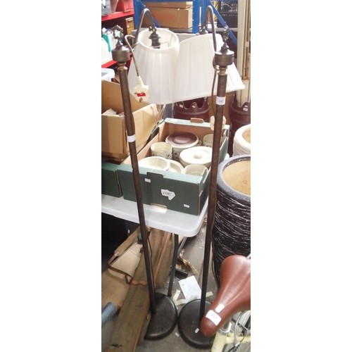 197 - A pair of vintage style floor standing lamps / lights.