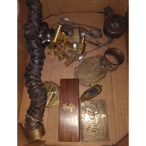 235 - A box of collectables to include a horn, sextant, belt buckles, compass, a brass pin cushion, metalw... 