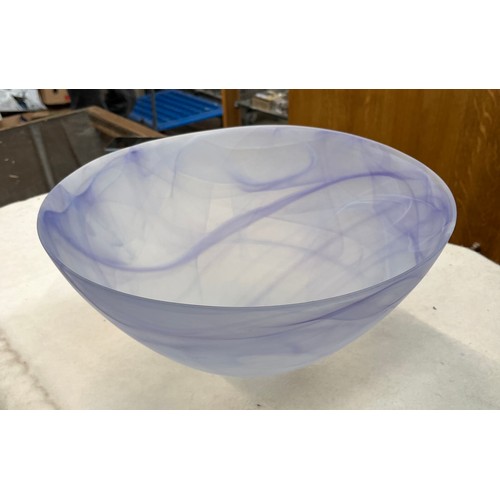 569 - A very large art glass bowl with lilac and white swirl design.  Height 19cm, diameter 39cm