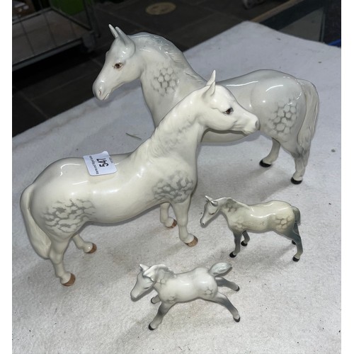 547 - Two white Beswick horses one called Connemara and two foals