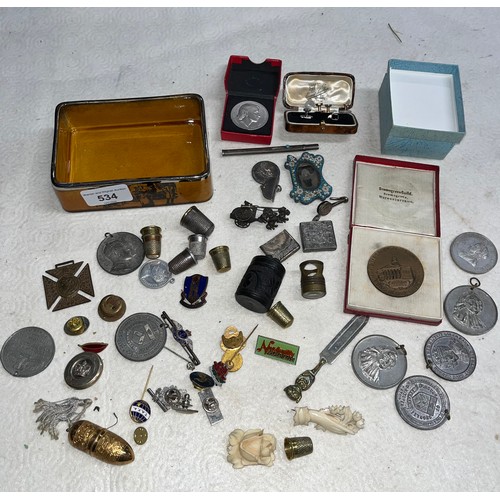 534 - Tin of medallions and thimbles etc.