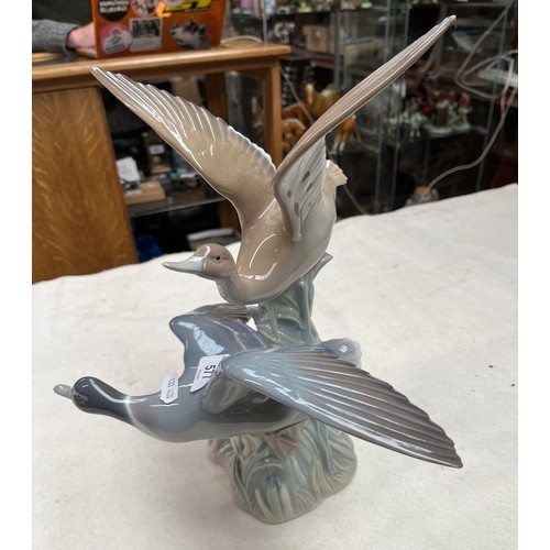 577 - Lladro - a very large figurine of a pair of ducks in flight.  Height approx 33cm, wingspan approx 31... 