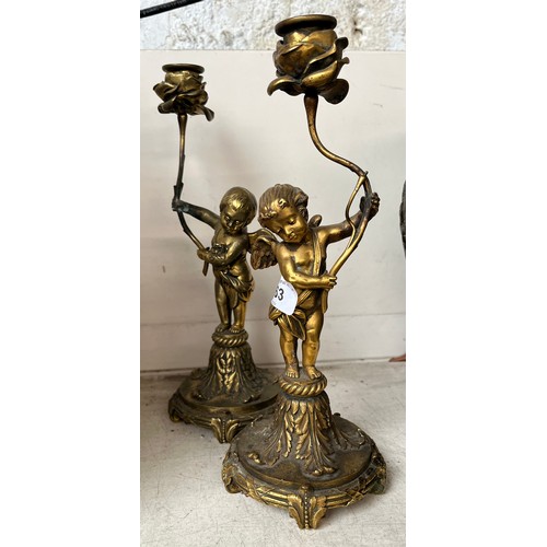 663 - Pair of metal figure candlesticks