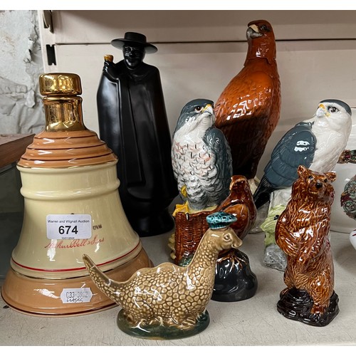 674 - 8 liquor flasks/decanters including a Golden Eagle decanter by Beswick, Peregrine Falcon and Merlin ... 