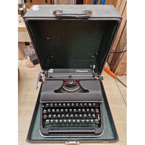 193 - A vintage Olympia  portable typewriter.