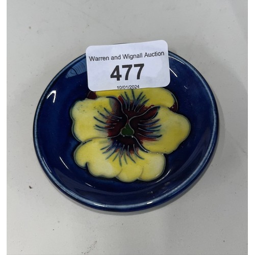 477 - A Moorcroft Pansy pin dish, yellow on blue ground, diameter appx 7.8cm