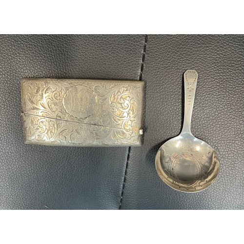 494 - A hallmarked silver card case, and a hallmarked Georgian silver caddy spoon