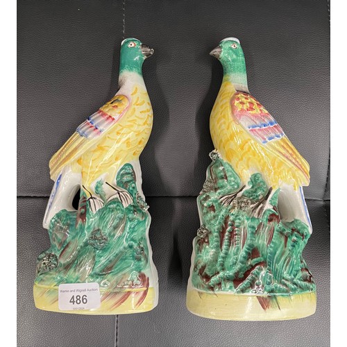 486 - A pair of coloured Staffordshire pigeon figurines