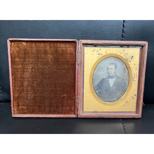 496 - A cased daguerrotype picture under glass. Case mwaures 11.5 x 10 cm appx