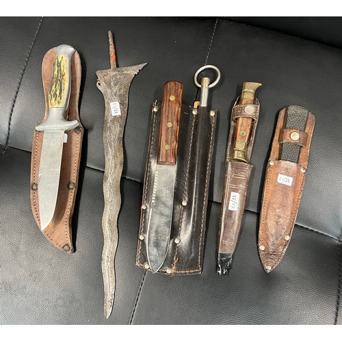 490 - A group of 5 knives comprising Slaters Venture with spike; Steyr Winternitz; French sheath knife; Sh... 