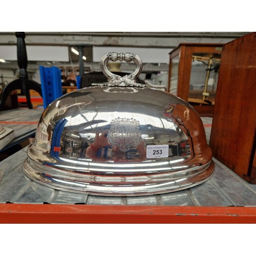 253 - A large plated dish cover with crest.