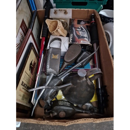 298 - A box of vintage oil cans, advertising pictures, monopod, clock, etc.