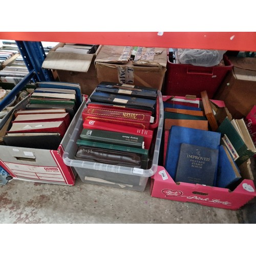 299 - Three boxes of stamp albums containing world stamps.