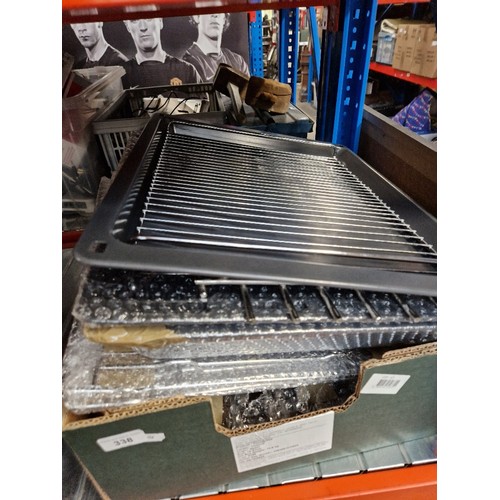 338 - A box of grill trays, etc - unused.