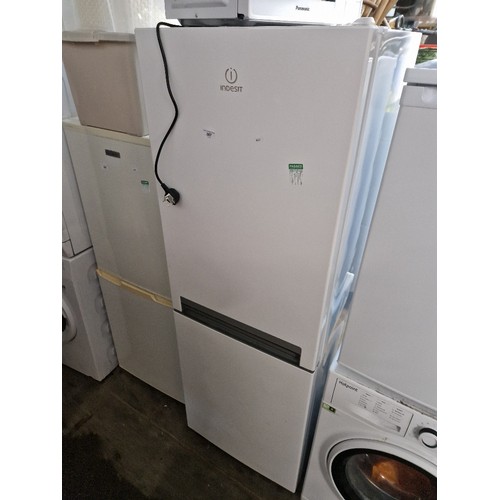 387 - A Panasonic microwave & an Indesit fridge freezer