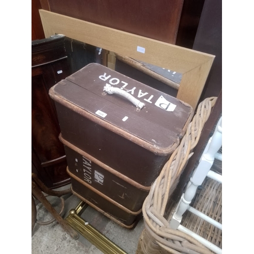 1028 - A vintage travel trunk together with a modern light oak framed mirror.