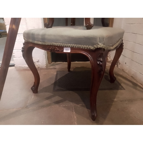 1031 - A Victorian walnut stool.