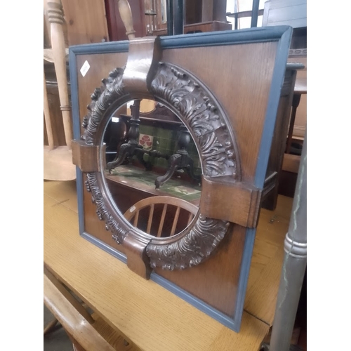 1033 - An early 20th century oak framed mirror.