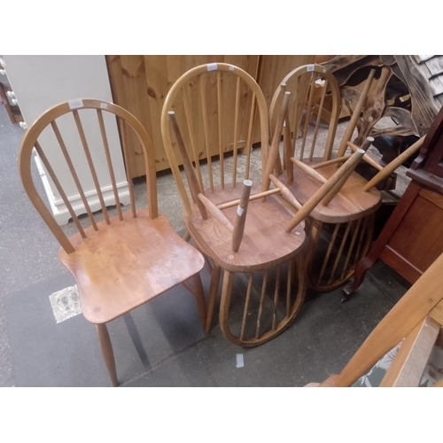 1035 - Five vintage Ercol light elm dining chairs.