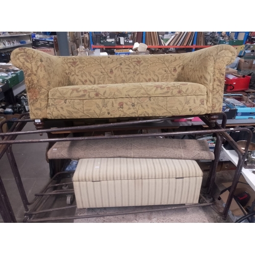 1040 - A late Victorian Chesterfield sofa together with an ottoman.