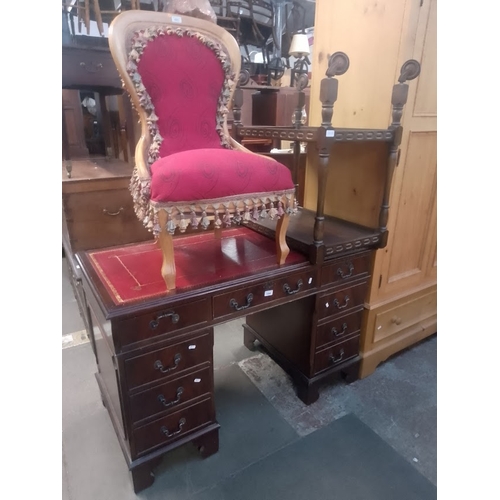 1044 - A mahogany pedestal desk together with an oak trolley.