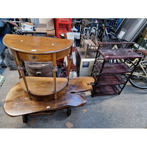 1050 - 3 pieces of furniture; rustic coffee table, a demi-lune table and a set of cane shelves.