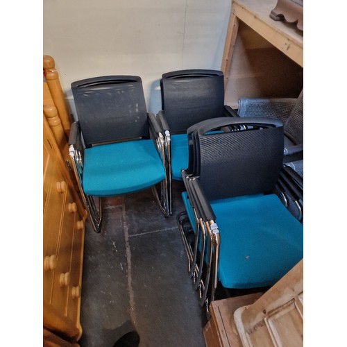 1055 - A set of ten modern office chairs.