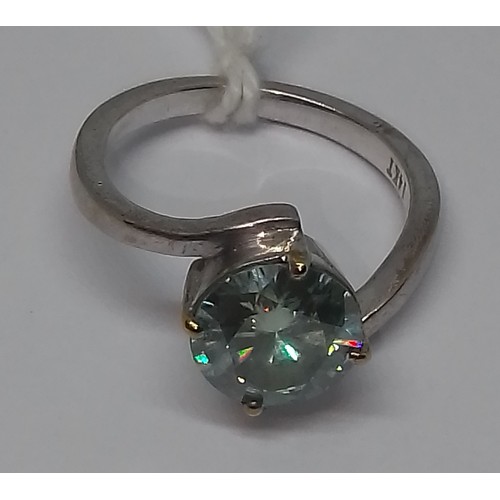 427 - A blue moissanite solitaire ring, marked '14KT', gross wt. 4.1g, size N.