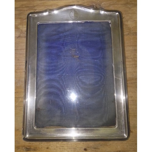 426 - A hallmarked silver photograph frame 20cm x 27cm.