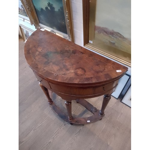 944 - A walnut demi-lune card table or credence table, circa 1700, with fold over top, three frieze drawer... 