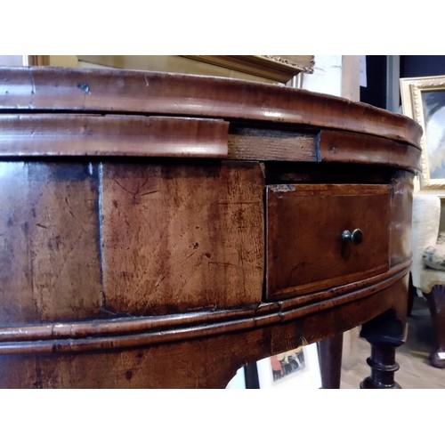 944 - A walnut demi-lune card table or credence table, circa 1700, with fold over top, three frieze drawer... 