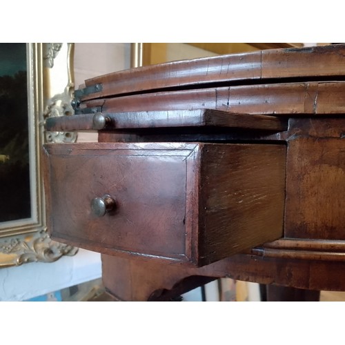 944 - A walnut demi-lune card table or credence table, circa 1700, with fold over top, three frieze drawer... 