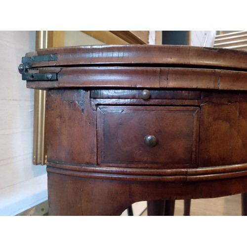 944 - A walnut demi-lune card table or credence table, circa 1700, with fold over top, three frieze drawer... 