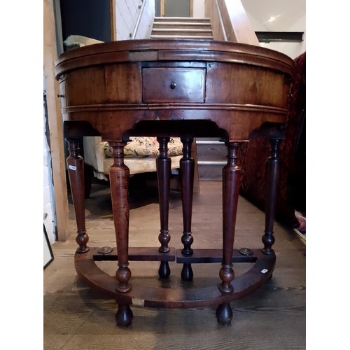 944 - A walnut demi-lune card table or credence table, circa 1700, with fold over top, three frieze drawer... 