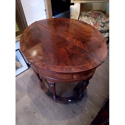 944 - A walnut demi-lune card table or credence table, circa 1700, with fold over top, three frieze drawer... 