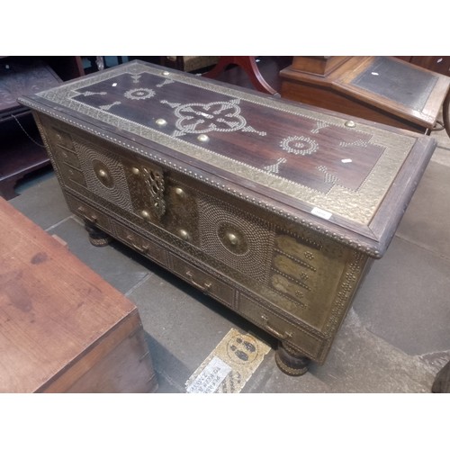 1016 - An Indian hardwood and brass studded chest.