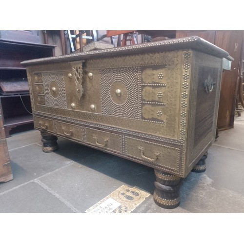 1016 - An Indian hardwood and brass studded chest.