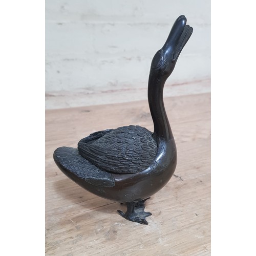 244 - A Japanese bronze incense burner modelled as a duck, height 19cm, together with a Japanese bronze ra... 