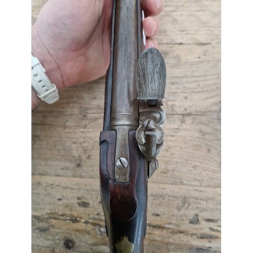 116 - A pair of reproduction flintlock pistols, 31cm barrel with ramrod below, touch hole is just an inden... 