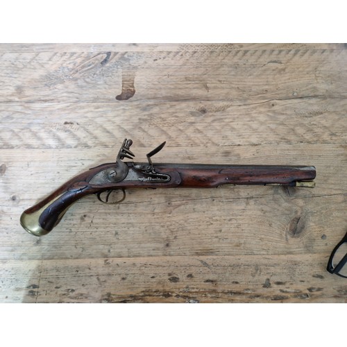 116 - A pair of reproduction flintlock pistols, 31cm barrel with ramrod below, touch hole is just an inden... 