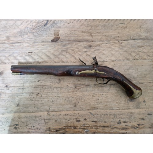 116 - A pair of reproduction flintlock pistols, 31cm barrel with ramrod below, touch hole is just an inden... 